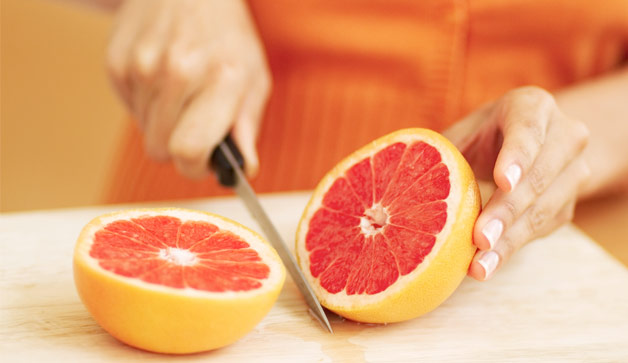 woman-cutting-grapefruit-628x363