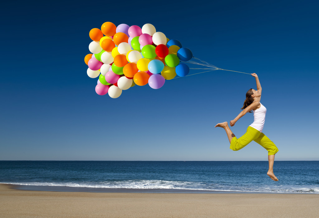 happy-woman-jumping-on-the-beach-1024x699-1024x699